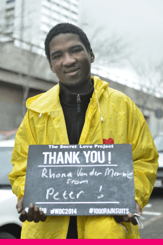 A grateful homeless gentleman saying thank you to The Secret Love Project for his winter rain suit