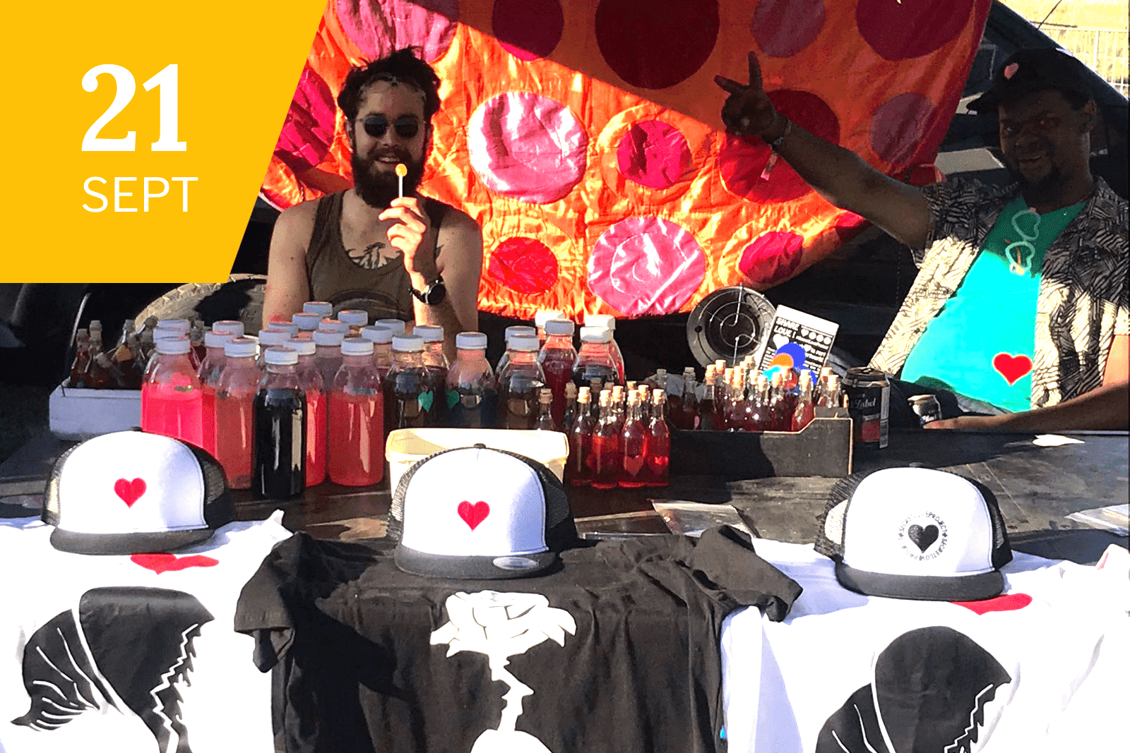 Volunteers raising money by selling The Secret Love Project Merchandise at the Earth Dance event 