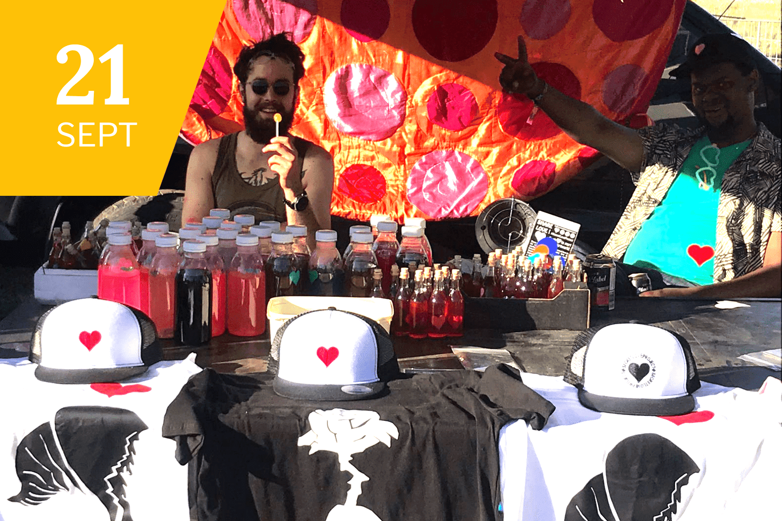 Volunteers raising money by selling The Secret Love Project Merchandise at the Earth Dance event
